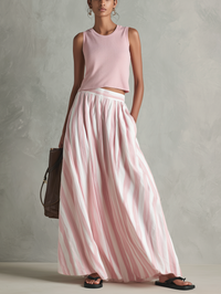 Damen Freizeit Pink Stretch-Strick Ärmelloses Rundhalsoberteil kombiniert mit einem gewebten pinken bedruckten Maxirock