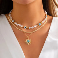 Schichtkette Set Parel & Böse Auge – Boho Sonne Anhänger