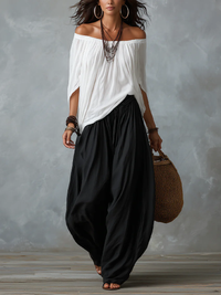 Top Bianco Off-Shoulder und Weite Lantern-Hosen